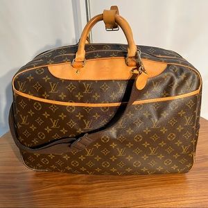 Original Louis Vuitton Alize 24 Heures monogram canvas travel bag. Like new.